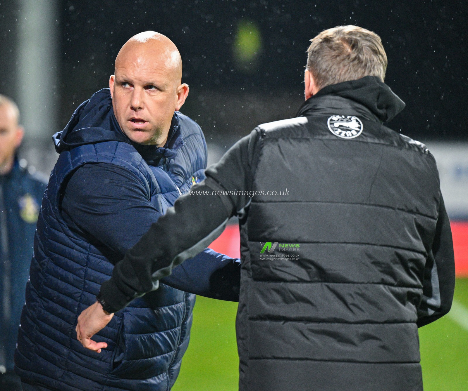 Matt Gray manager of Sutton United Football Club shakes hands with Phil Parkinson manager of Wrexham Association Football Club ahead of kick off, during the Sky Bet League 2 match Wrexham vs Sutton United at SToK Cae Ras, Wrexham, United Kingdom, 24th October 2023

(Photo by Cody Froggatt/News Images)