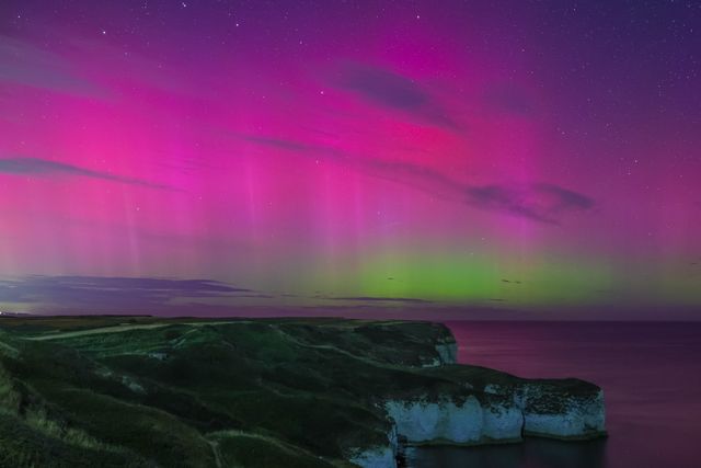 Northern Lights also know as the Aurora Borealis shines over Bempton Cliffs