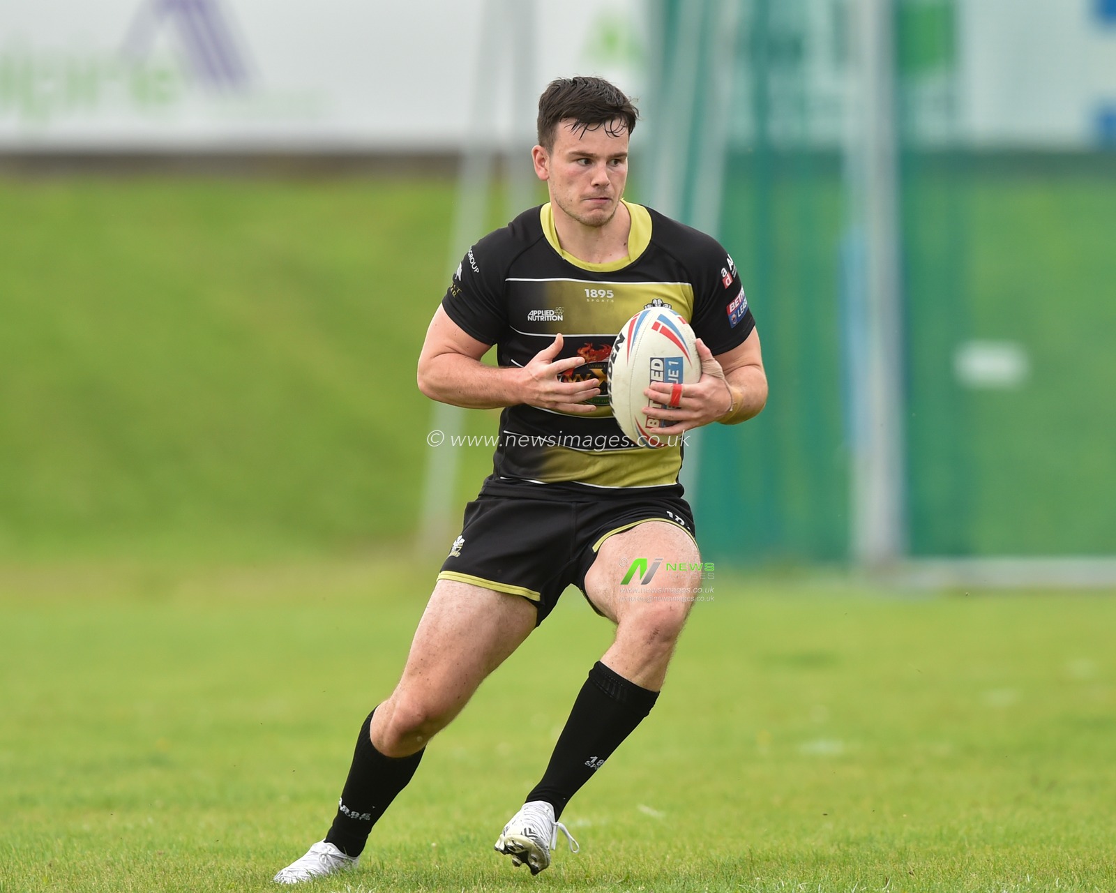 Alex Eckley of North Wales Crusaders in action during the game