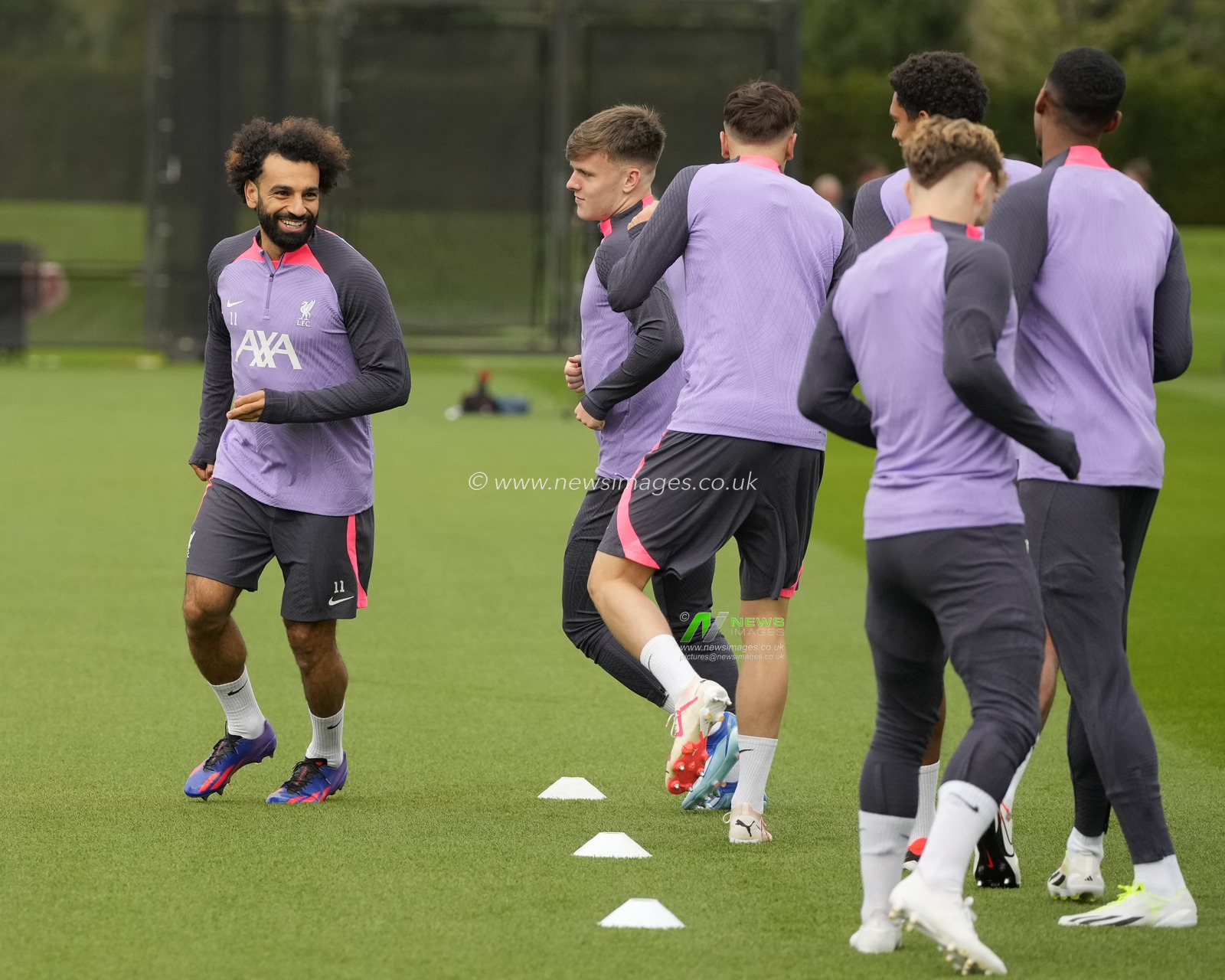 Mohamed Salah #11 of Liverpool leads a group of Liverpool players as they warm up during the Europa League Training Session at AXA Training Centre, Kirkby, United Kingdom, 4th October 2023

(Photo by Steve Flynn/News Images)