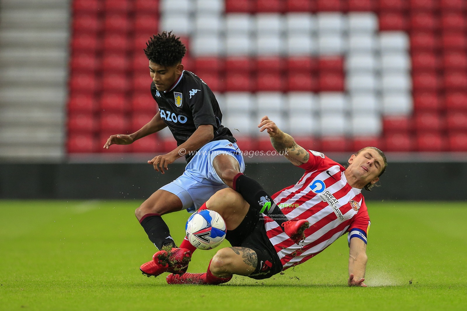 Max Power (6) of Sunderland tackles Aaron Ramsey (64) of Aston Villa u21s