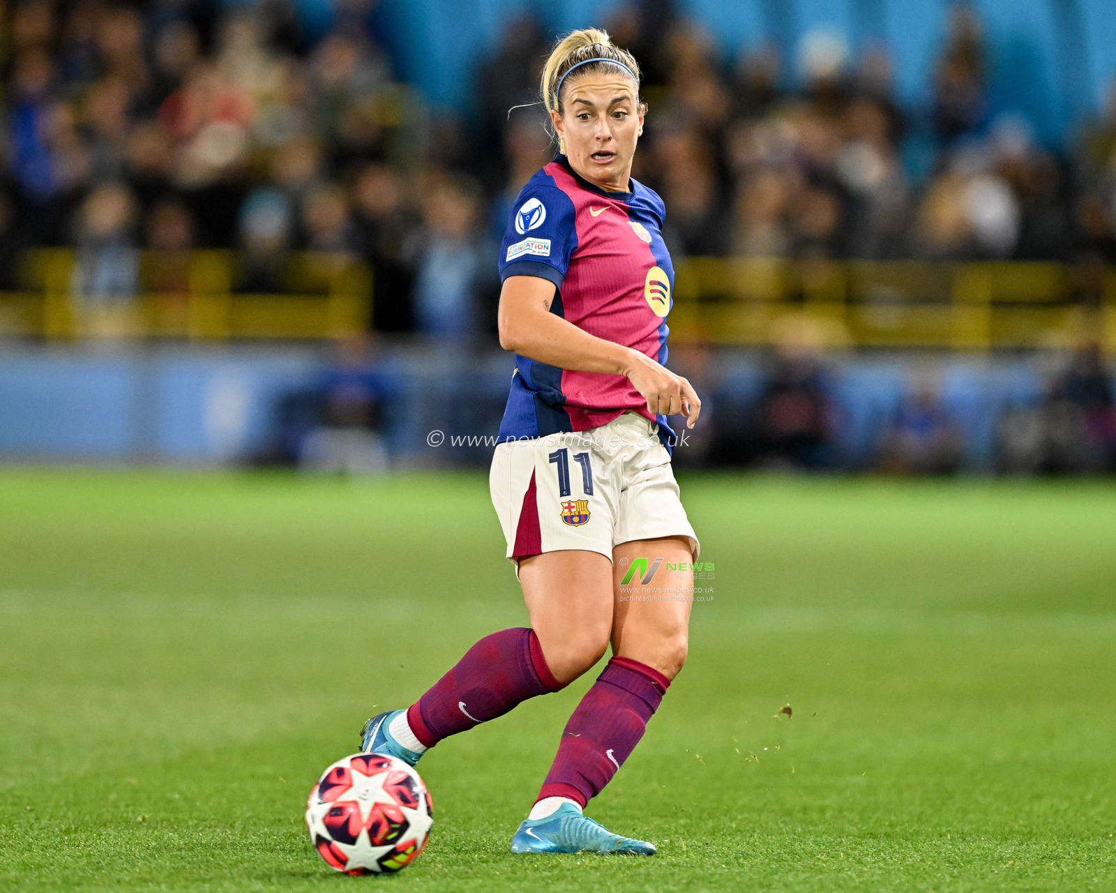Alexia Putellas of Barcelona FemenÃ­ passes the ball during the UEFA Women's Champions League match  - Group D - Manchester City vs Barcelona at Manchester City Academy Stadium, Manchester, United Kingdom, 9th October 2024

(Photo by Cody Froggatt/News Images)