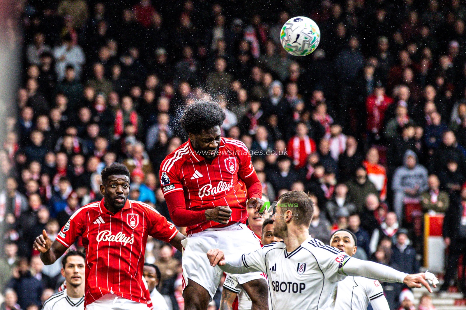 Ola Aina of Nottingham Forest clears from his defensive area during the Premier League match Nottingham Forest vs Fulham at City Ground, Nottingham, United Kingdom on 15 March 2026

(Photo by Alfie Cosgrove/News Images)