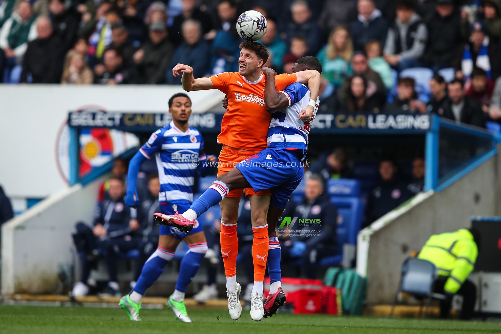 Jake Beesley of Blackpool and Clinton Mola of Reading battle for the ball during the Sky Bet League 1 match Reading vs Blackpool at Select Car Leasing Stadium, Reading, United Kingdom, 27th April 2024

(Photo by Gareth Evans/News Images)
