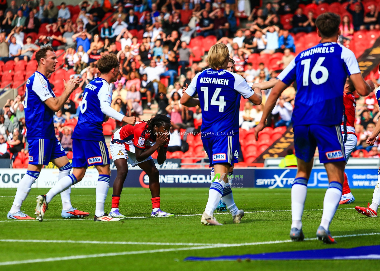Damola Ajayi of Doncaster Rovers reacts to a missed chance during the Sky Bet League 1 match Doncaster Rovers vs Exeter City at Eco-Power Stadium, Doncaster, United Kingdom, 2nd August 2025

(Photo by Richard Bierton/News Images)