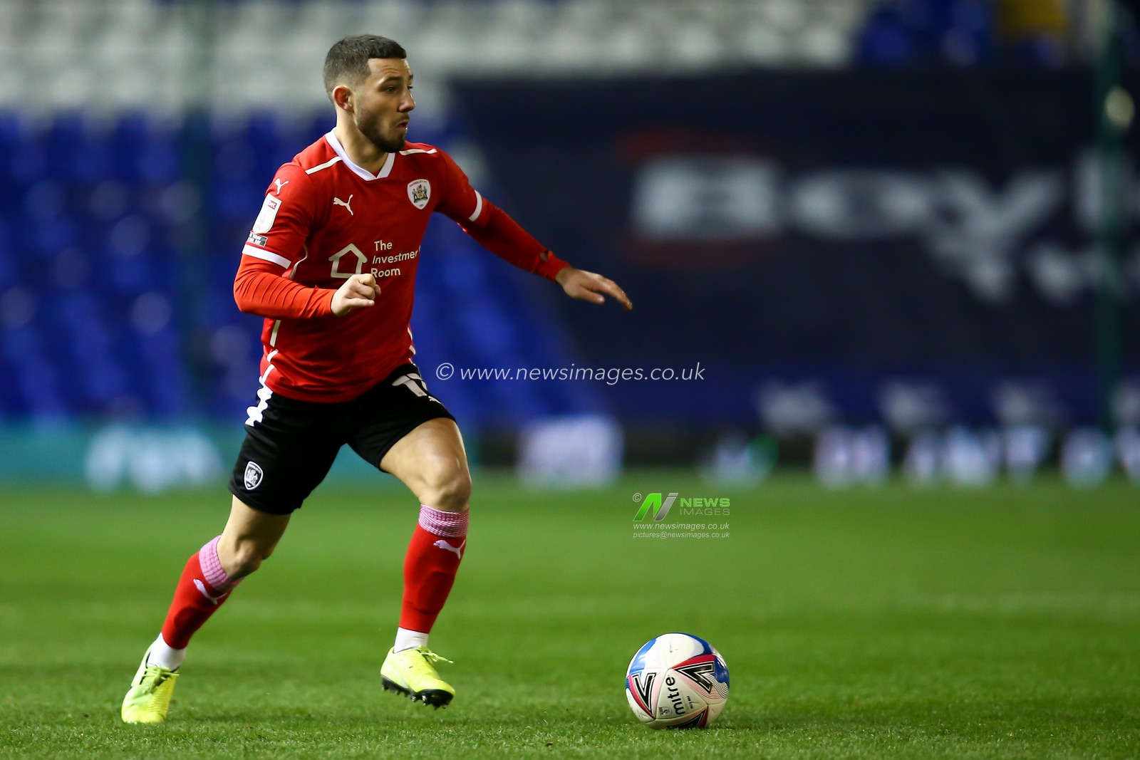 Conor Chaplin #11 of Barnsley dribbles the ball