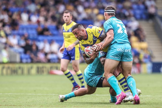 Paul Vaughan of Warrington Wolves is tackled during the Betfred Super League round 15 match Warrington Wolves vs Huddersfield Giants at Halliwell Jones Stadium, Warrington, United Kingdom, 21st June 2025

(Photo by Alfie Cosgrove/News Images)