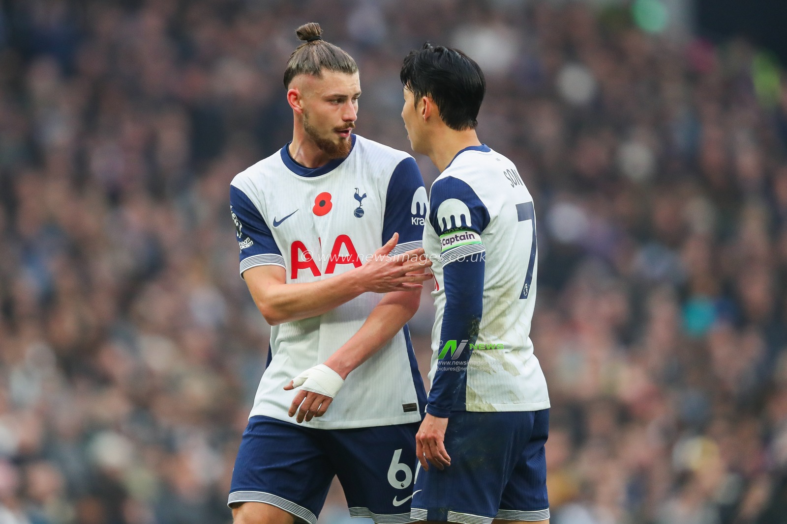 Radu DrÄƒguÈ™in of Tottenham Hotspur speaks to Heung-min Son during the Premier League match Tottenham Hotspur vs Ipswich Town at Tottenham Hotspur Stadium, London, United Kingdom, 10th November 2024

(Photo by Izzy Poles/News Images)