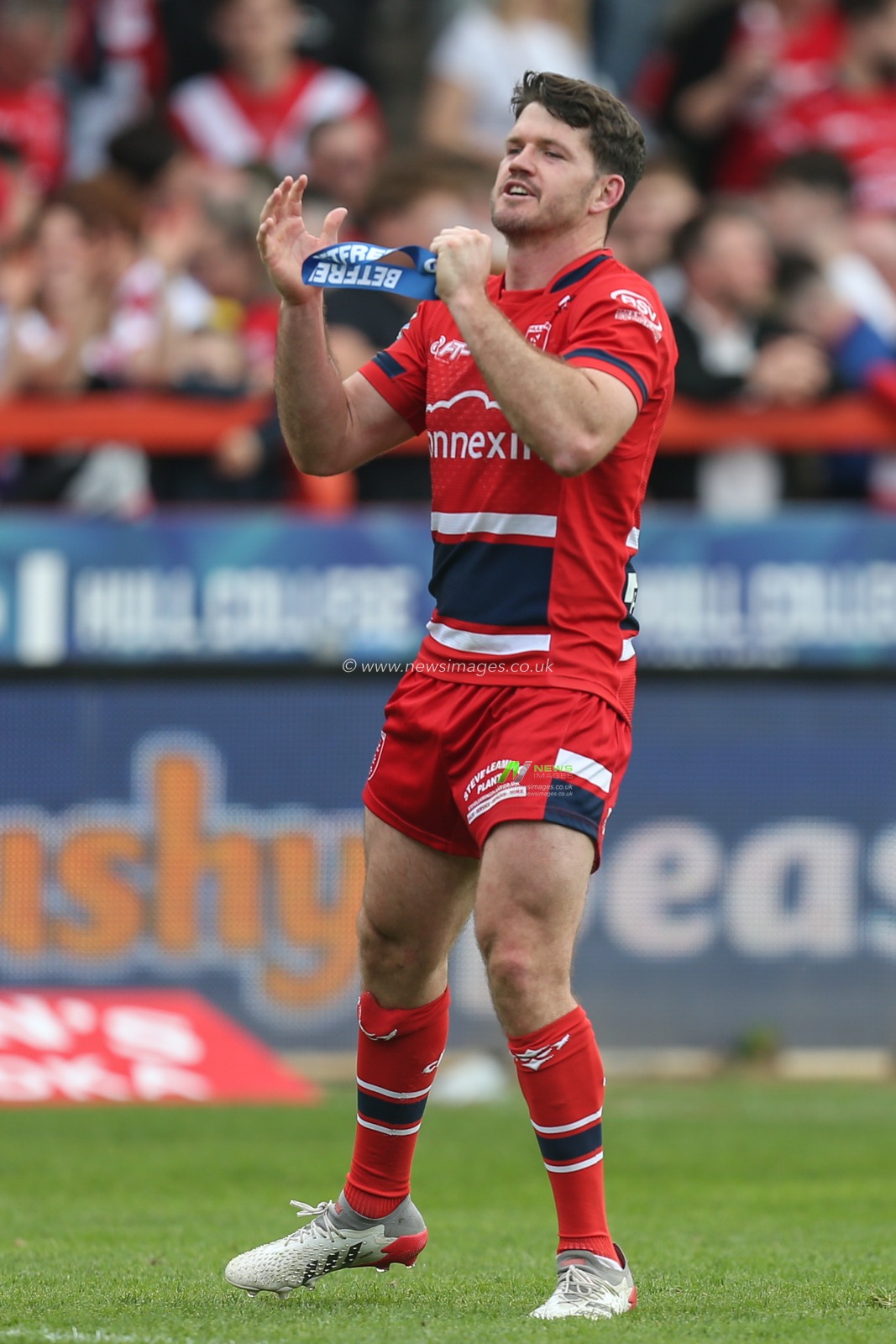 Lachlan Coote #1 of Hull KR runs around the pitch applauding the Hull KR fans after being interviewed by SKY Sports
