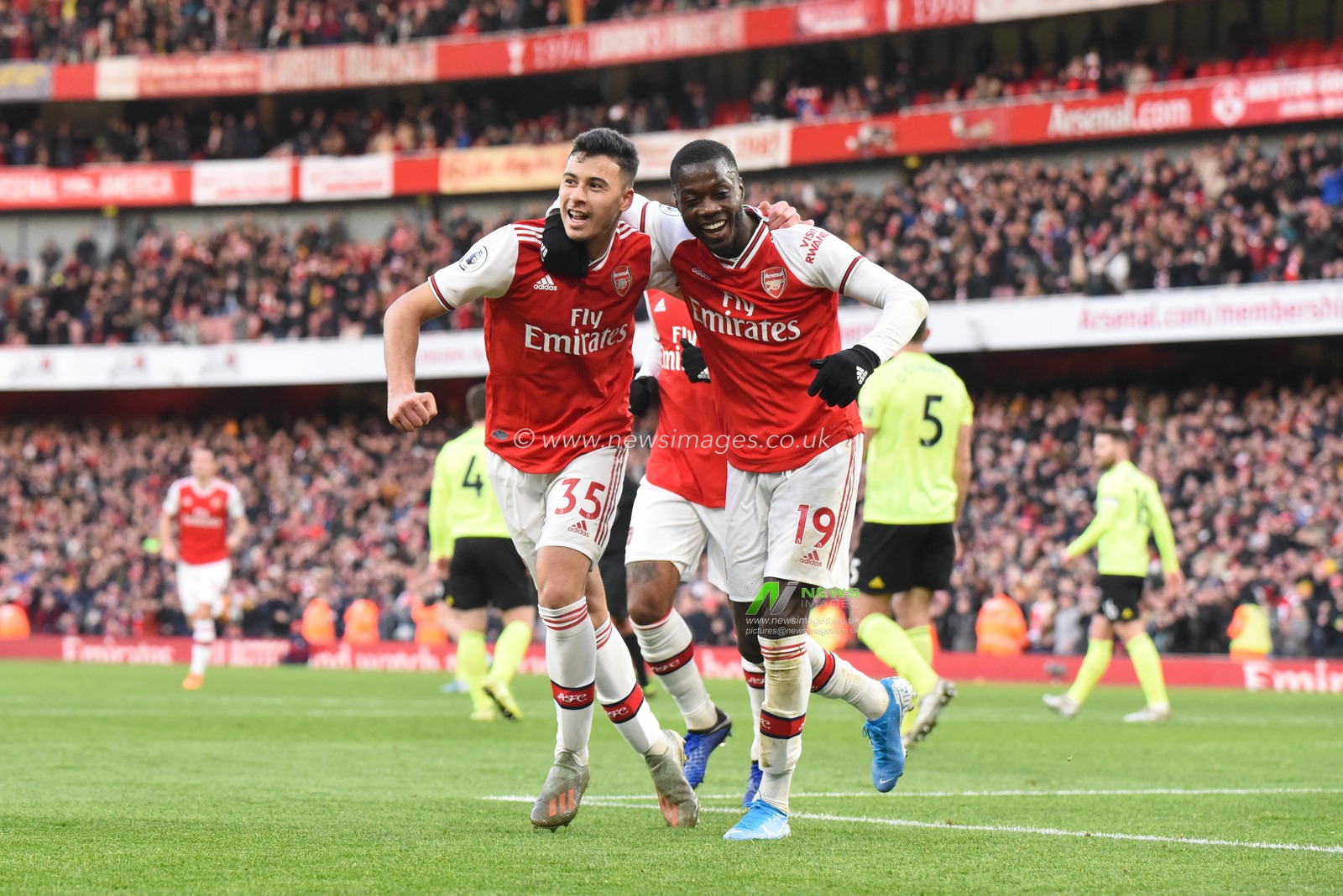 18th January 2020, Emirates Stadium, London, England; Premier League, Arsenal v Sheffield United : Gabriel Martinelli (35) of Arsenal celebrates with Nicolas Pepe (19) after scoring a goal to make the score 1-0

Credit: Simon Whitehead/News Images