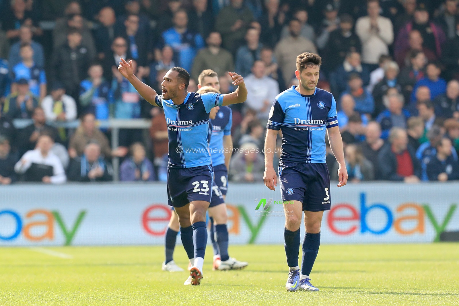 Jordan Obita #23 of Wycombe Wanderers gees up the fans after his goal.