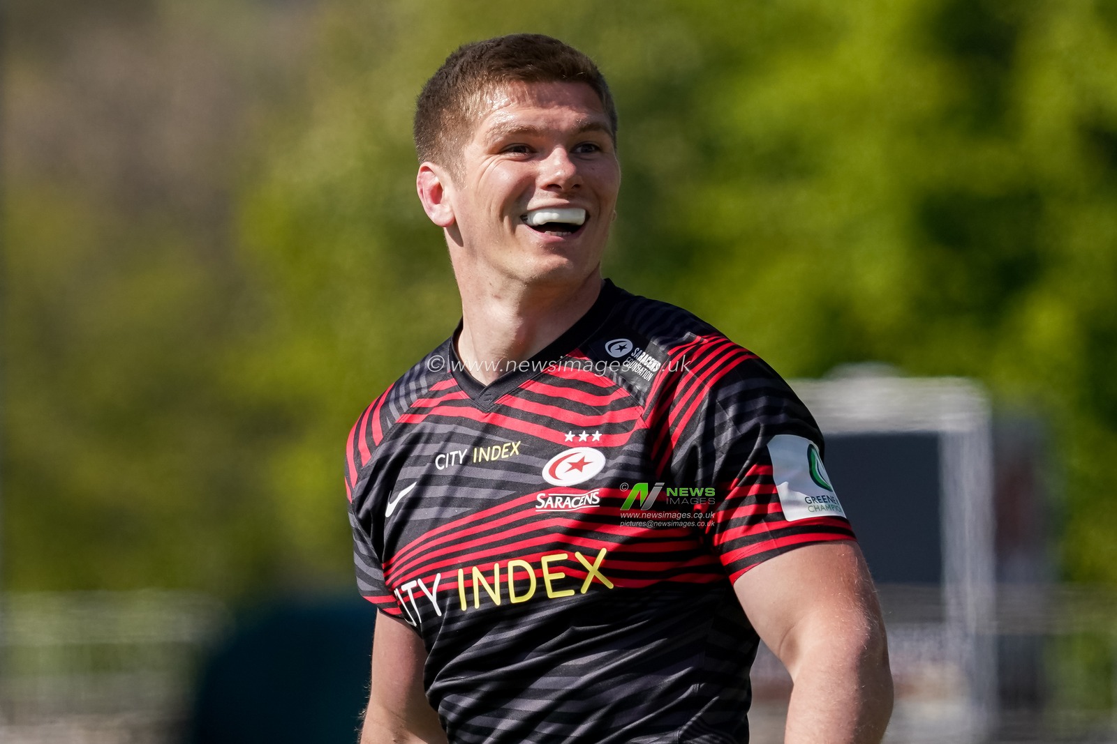 Owen Farrell #10 of Saracens shares a joke