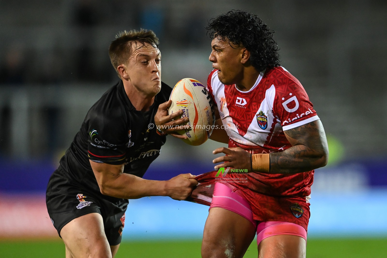 Tesi Niu of Tonga is tackles by Ollie Olds of Wales during the Rugby League World Cup 2021 match Tonga vs Wales at Totally Wicked Stadium, St Helens, United Kingdom, 24th October 2022

(Photo by Craig Thomas/News Images)