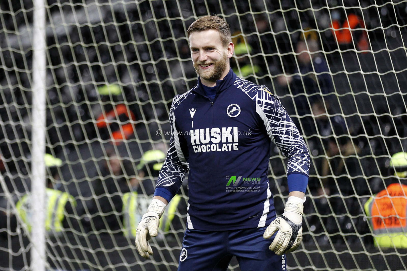 George Long #1 of Millwall warms up.