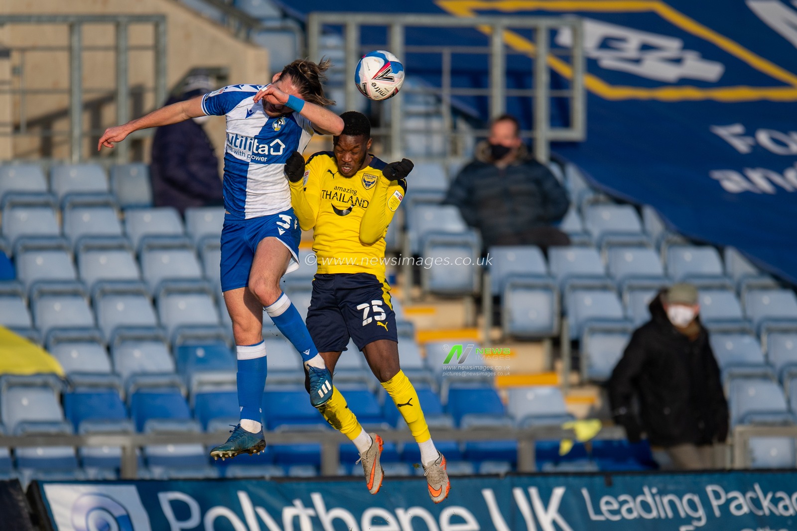 Luke Leahy #3 of Bristol Rovers and Olamide Shodipo #25 of Oxford United both challenge for the ball in the air