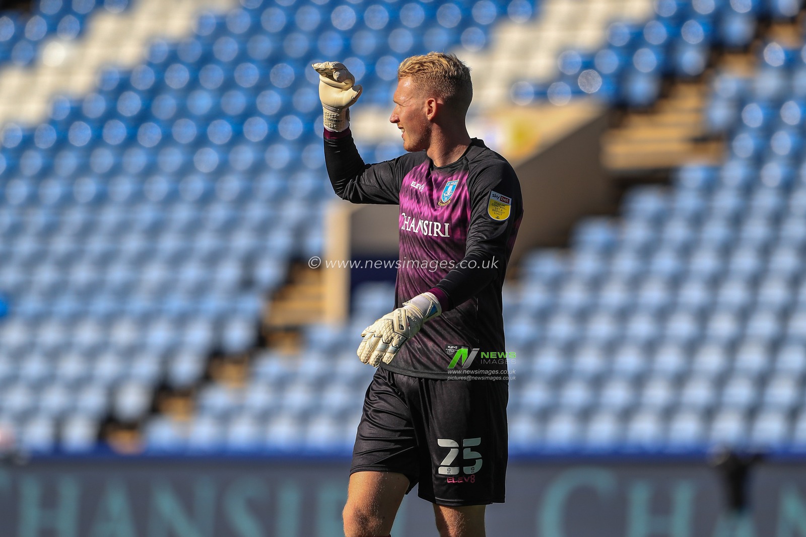 Cameron Dawson (25) of Sheffield Wednesday hold his had up to block the sun