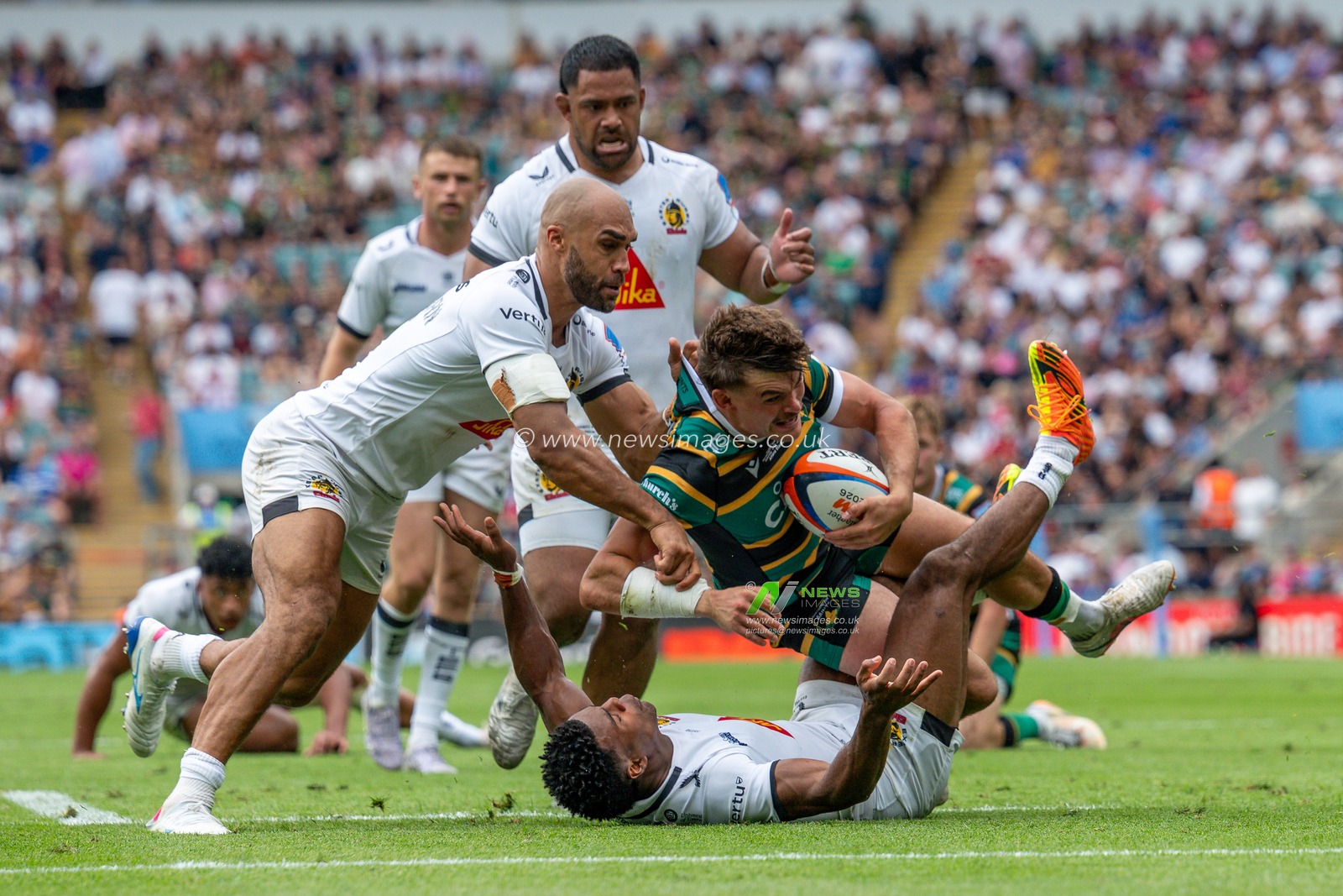 George Furbank of Northampton Saints tackled by Olly Woodburn of Exeter Chiefs and Immanuel Feyi-Waboso of Exeter Chiefs during the Gallagher PREM Final match Northampton Saints vs Exeter Chiefs at Allianz Stadium, Twickenham, United Kingdom on 20 June 2026.

(Photo by Alex Williamson/News Images)