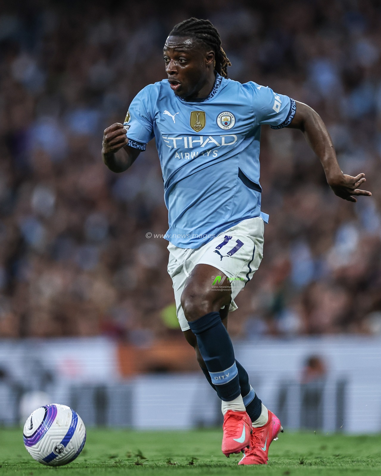 JÃ©rÃ©my Doku of Manchester City breaks with the ball during the Premier League match Manchester City vs Wolverhampton Wanderers at Etihad Stadium, Manchester, United Kingdom, 2nd May 2025

(Photo by Mark Cosgrove/News Images)
