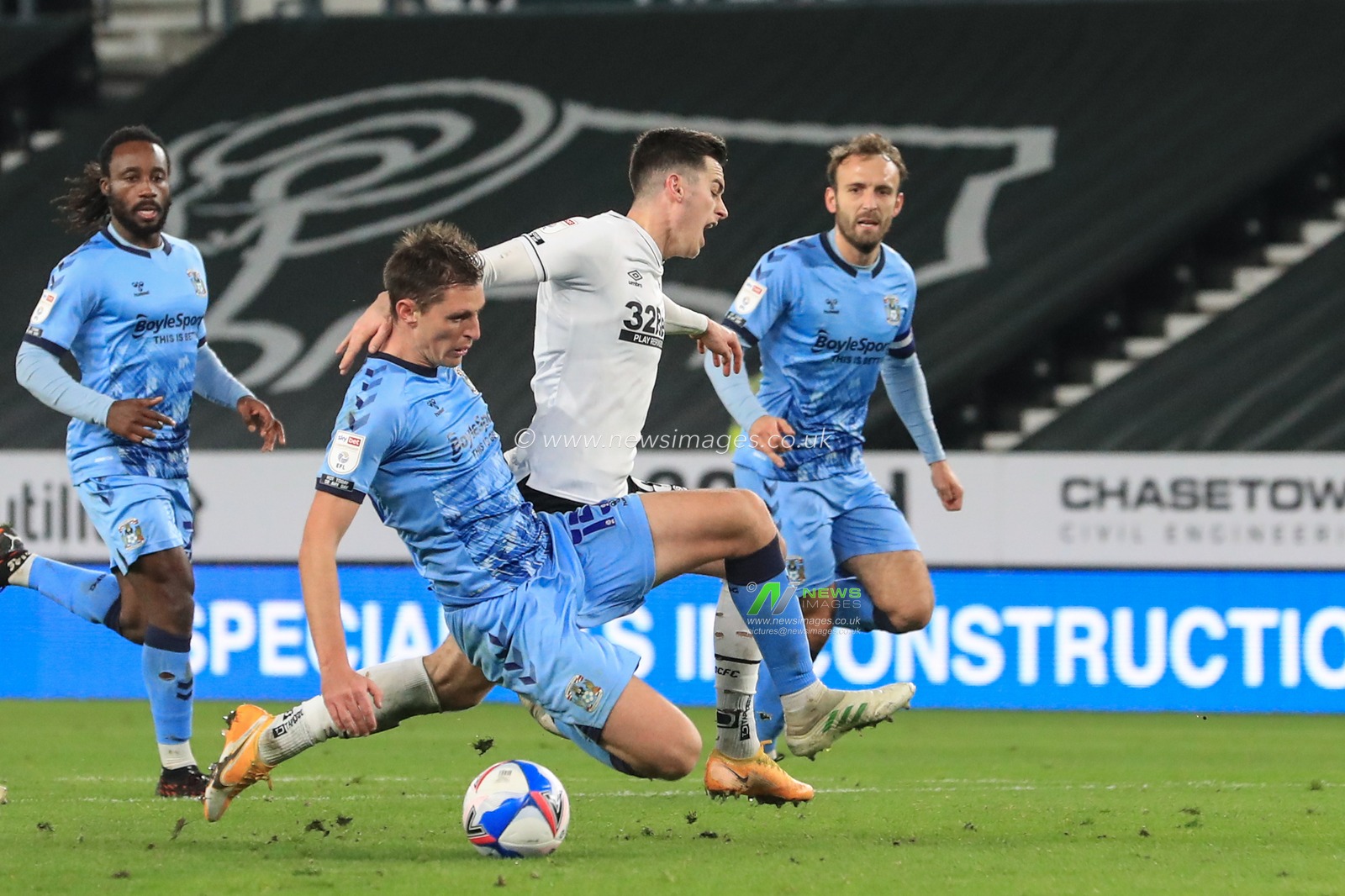 Dominic Hyam #15 of Coventry City tackles Tom Lawrence #10 of Derby County, Lawrence appeals for a penalty, referee Dean Whitestone waves it off