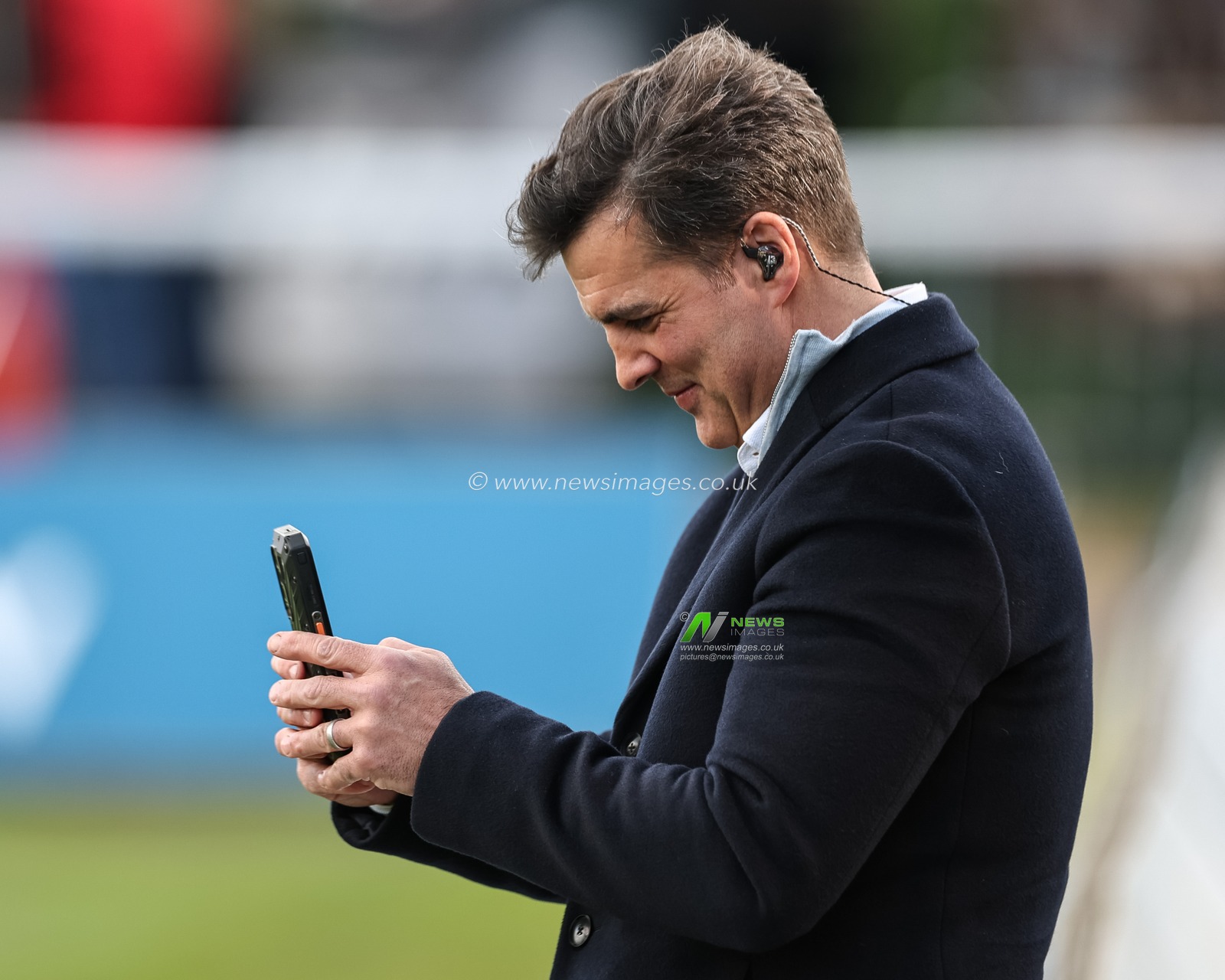 Brian Carney on his phone during the Betfred Super League Round 9 match Hull KR vs Wigan Warriors at Sewell Group Craven Park, Kingston upon Hull, United Kingdom, 26th April 2024

(Photo by Mark Cosgrove/News Images)