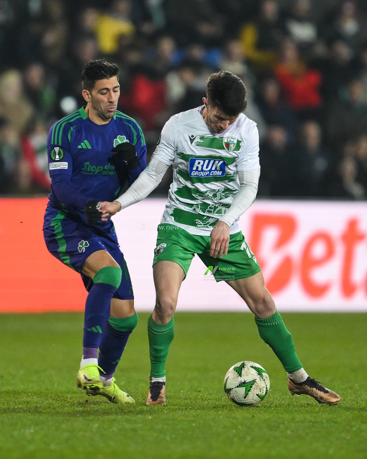 Rory Holden of The New Saints F.C. holds off Dimitris Limnios of Panathinaikos during the UEFA Conference League - League Stage The New Saints v Panathinaikos at Croud Meadow, Shrewsbury, United Kingdom, 12th December 2024

(Photo by Craig Thomas/News Images)