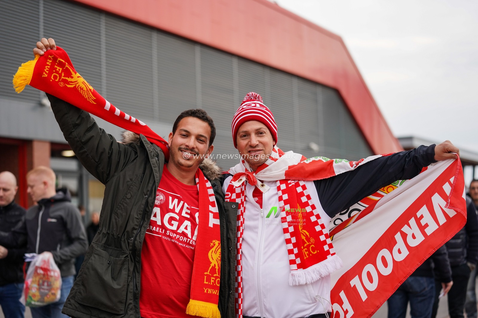 7th May 2019 , Anfield Stadium, Liverpool, England;  UEFA Champions League Semi Final, Second Leg, Liverpool FC vs FC Barcelona ; Two Liverpool fans wrapped in club scarfs and flags


Credit: Terry Donnelly/News Images