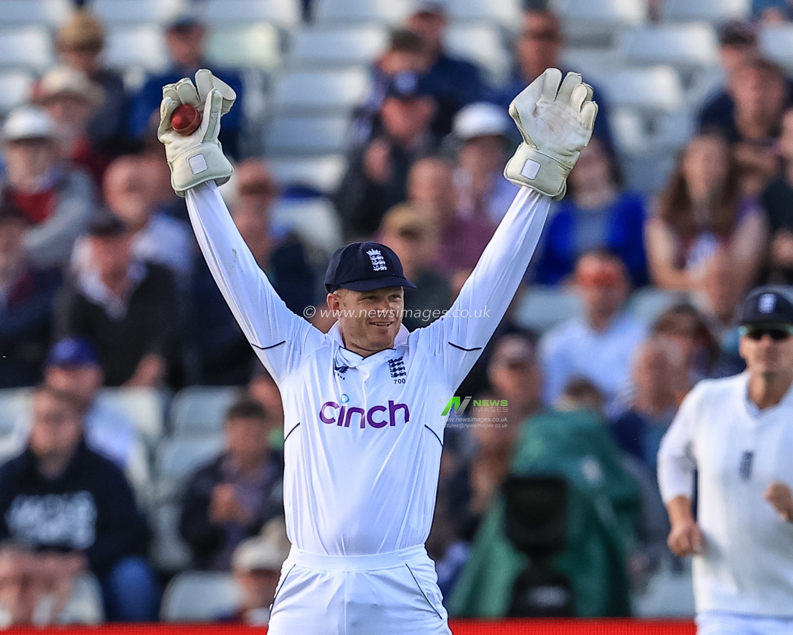 Sam Billings of England celebrates catching Shardul Thakur of India