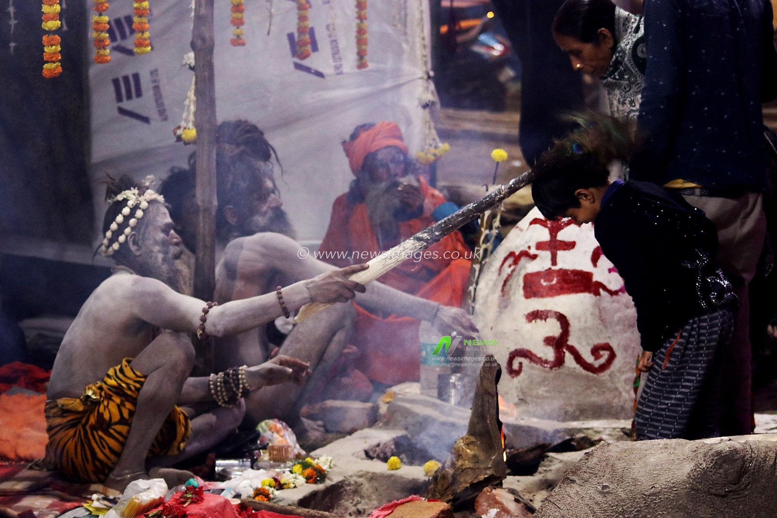 A Naga saint is giving his blessings to pilgrims at a transit camp of the Gangasagar fair in Kolkata, India, on January 5, 2025. The Gangasagar Mela is an annual Hindu festival held at Gangasagar, West Bengal, where the Ganges River meets the Bay of Bengal. The fair takes place at Kapilmuni's ashram on Gangasagar every year on Makar Sankranti.Pictures by Debajyoti Chakraborty.(Photo: Debajyoti Chakraborty/News Images)