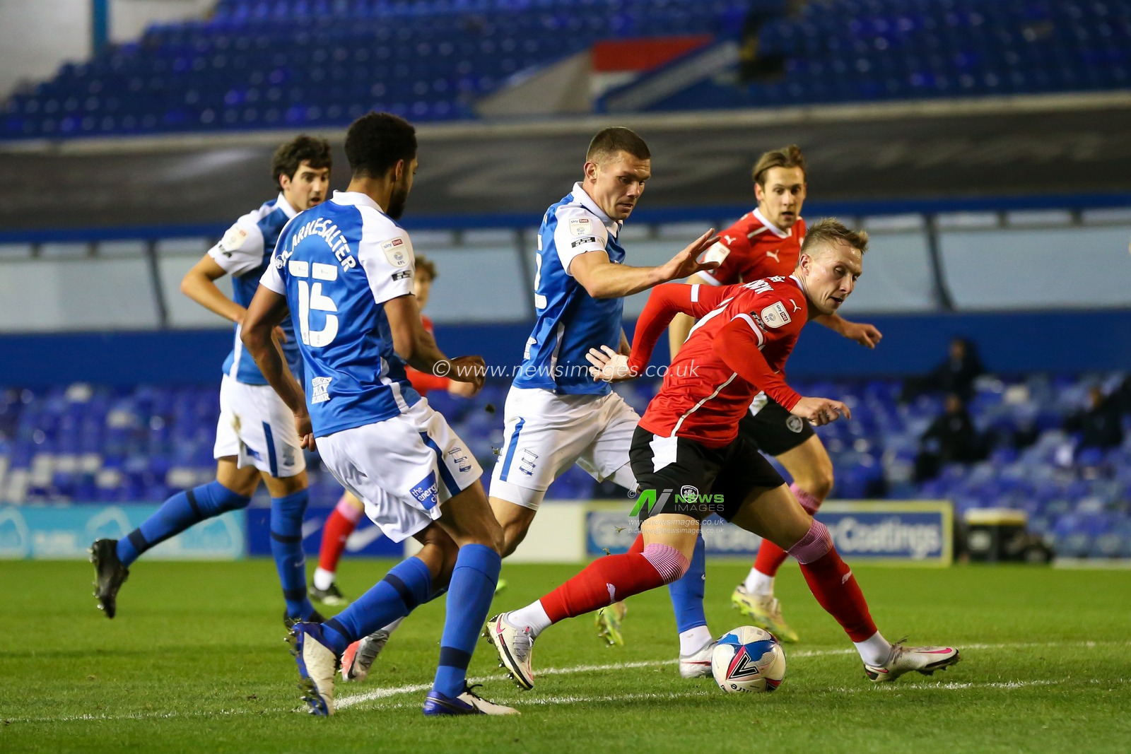 Cauley Woodrow #9 of Barnsley protects the ball from the Birmingham City defence