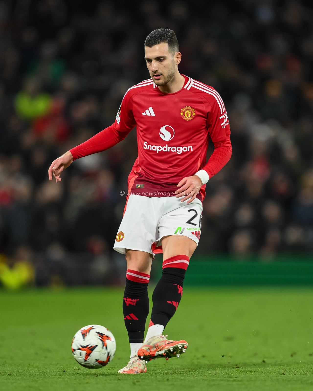 Diogo Dalot of Manchester United passes the ball during the UEFA Europa League Last 16 match Manchester United vs Real Sociedad at Old Trafford, Manchester, United Kingdom, 13th March 2025

(Photo by Craig Thomas/News Images)