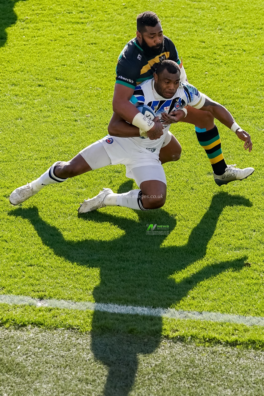 Taqele Naiyaravoro #11 of Northampton Saints tackles   Semesa Rokoduguni #14 of Bath Rugby