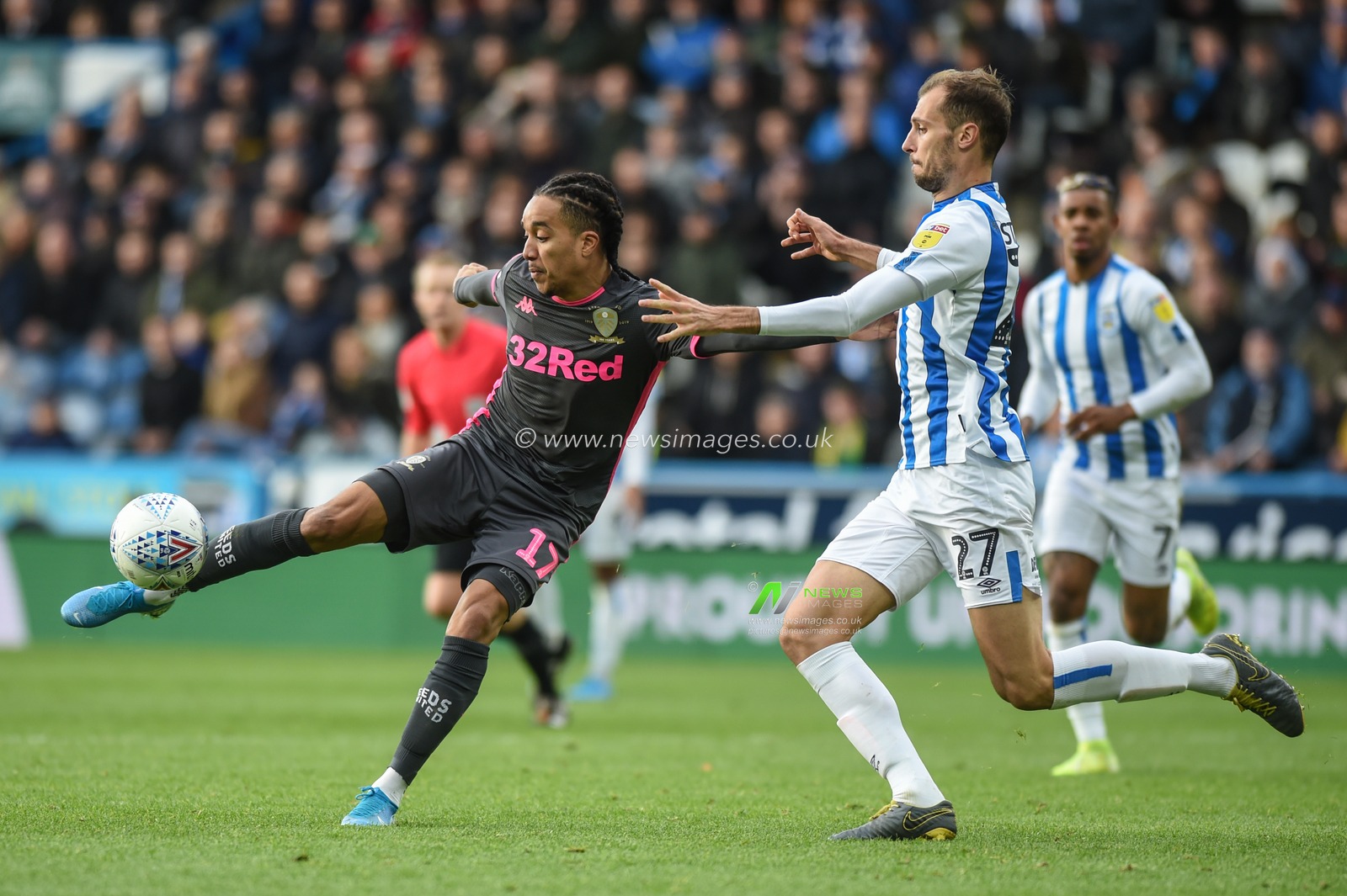 7th December 2019, John Smith's Stadium, Huddersfield, England; Sky Bet Championship, Huddersfield Town v Leeds United :Helder Costa (17) of Leeds United takes a first half shot despite attention from Jon Gorenc Stankovic (27) of Huddersfield Town 

Credit: Dean Williams/News Images