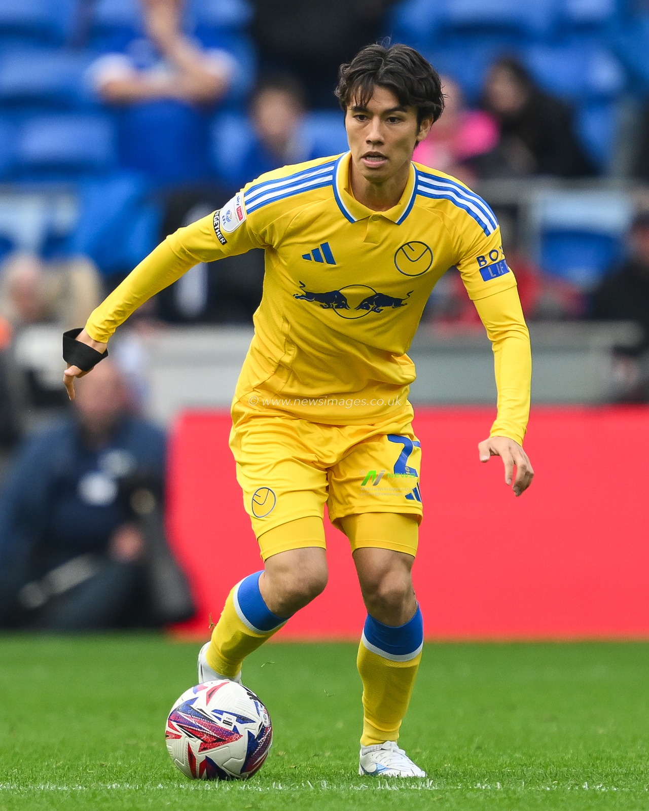 Ao Tanaka of Leeds United makes a break with the ball during the Sky Bet Championship match Cardiff City vs Leeds United at Cardiff City Stadium, Cardiff, United Kingdom, 21st September 2024

(Photo by Craig Thomas/News Images)