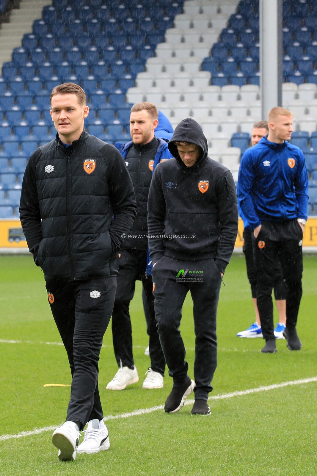 Sean McLoughlin #17 of Hull City with Keane Lewis-Potter #11 of Hull City check the pitch.