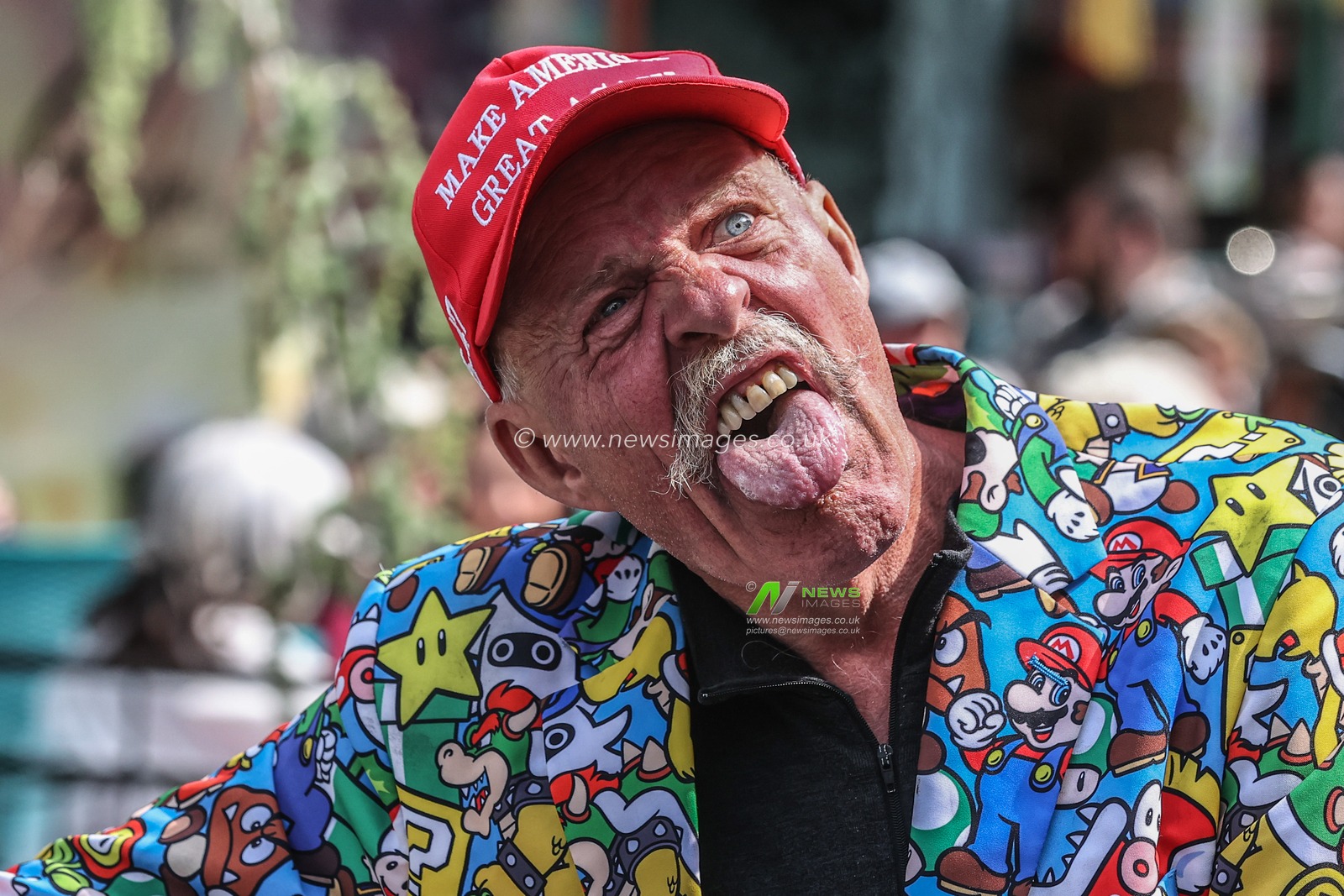 A President Donald trump supporter walks through the streets of Stavanger wearing a Nintendo Mario & Luigi jacket and a red hat with Make America Great Again on , Rogaland, Norway, 9th June 2025

(Photo by Alfie Cosgrove/News Images)