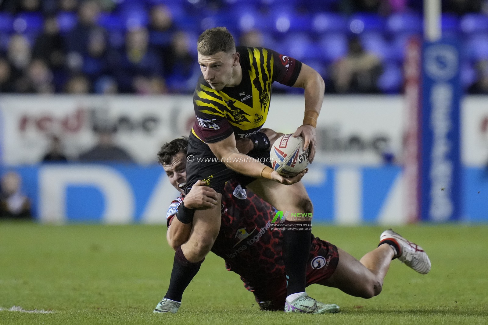 Kai Oâ€™Donnell of Leigh Leopards tackles George Williams of Warrington Wolves  during the Rugby League Joe Philbin Testimonial match Warrington Wolves vs Leigh Leopards at Halliwell Jones Stadium, Warrington, United Kingdom, 3rd February 2024

(Photo by Steve Flynn/News Images)