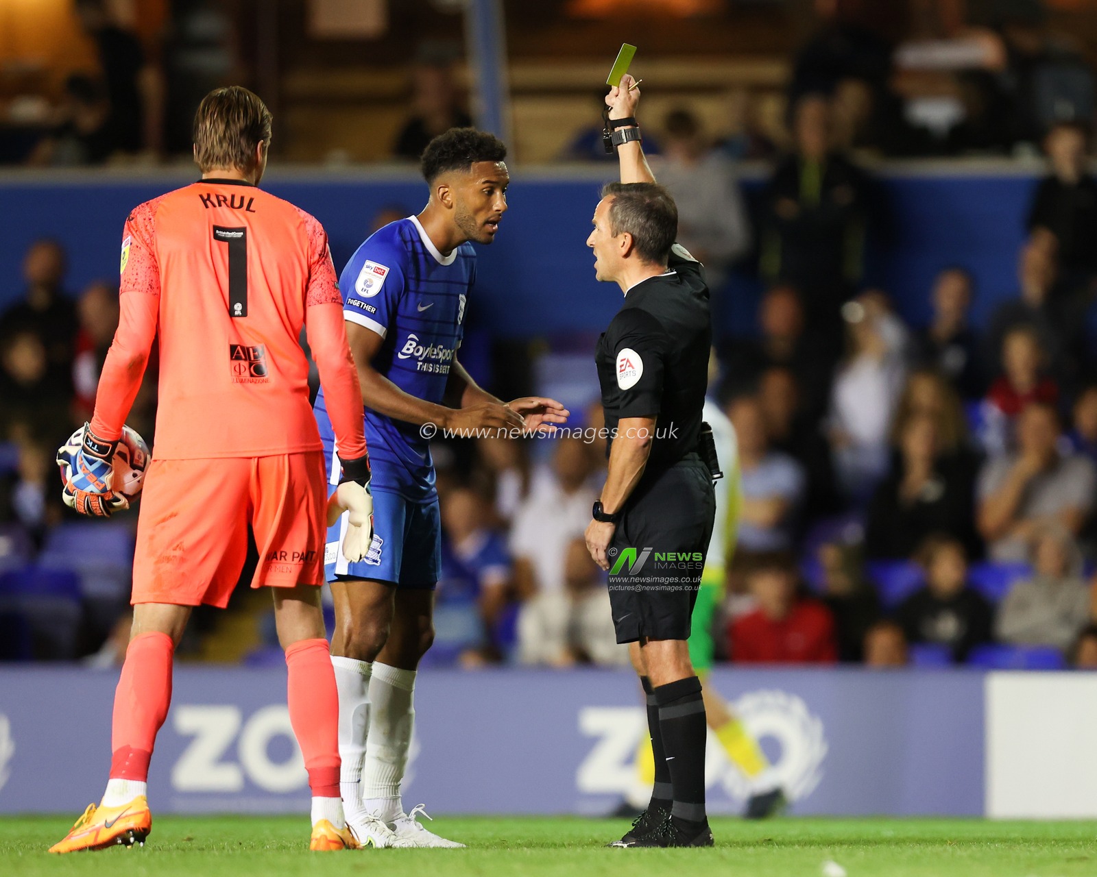 Auston Trusty #5 of Birmingham City  receives a yellow card from Referee Keith Stroud