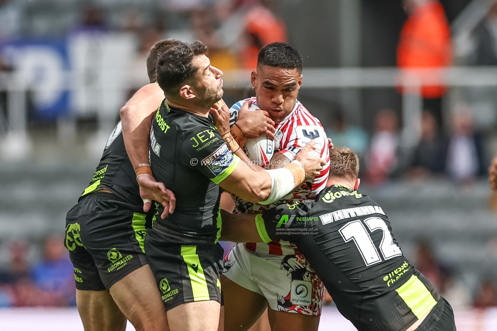 Joe Ofahengaue of Leagh Leopards is tackled by Elliott Whitehead of Catalan Dragons and Benjamin Garcia of Catalan Dragons during the Betfred Magic Weekend 2025 match Leigh Leopards vs Catalans Dragons at St. James's Park, Newcastle, United Kingdom, 3rd May 2025

(Photo by Mark Cosgrove/News Images)