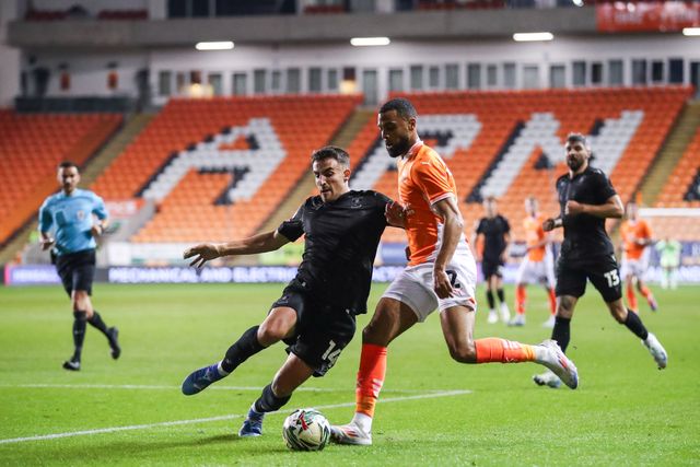 Pol ValentÃ­n of Sheffield Wednesday tackles CJ Hamilton of Blackpool during the Carabao Cup match Blackpool vs Sheffield Wednesday at Bloomfield Road, Blackpool, United Kingdom, 17th September 2024

(Photo by Gareth Evans/News Images)