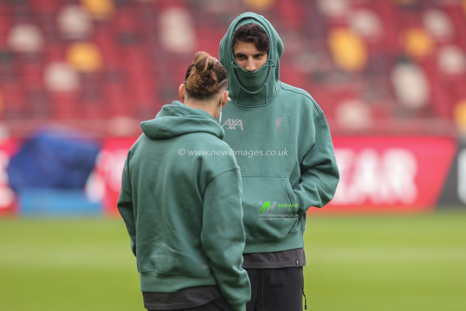 Dominik Szoboszlai of Liverpool and Kostas Tsimikas of Liverpool arrive during the Premier League match Brentford vs Liverpool at The Gtech Community Stadium, London, United Kingdom, 18th January 2025

(Photo by Alfie Cosgrove/News Images)