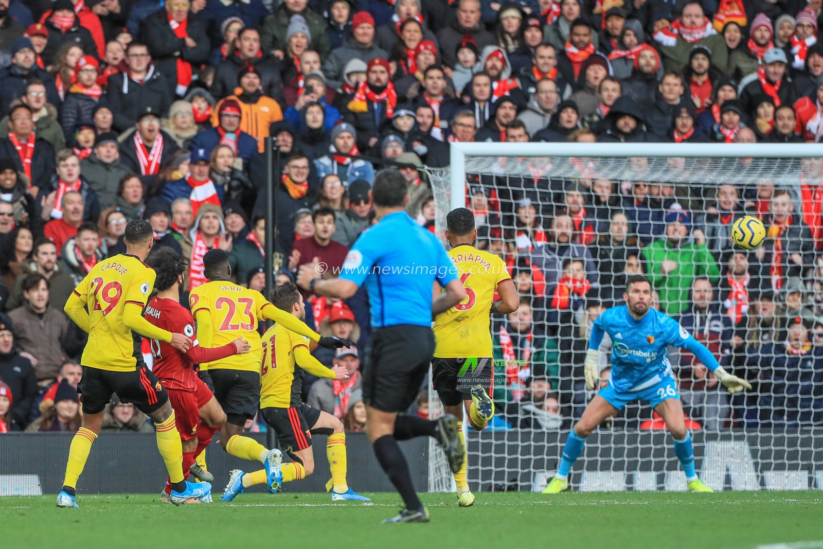 14th December 2019, Anfield, Liverpool, England; Premier League, Liverpool v Watford :  Mohamed Salah (11) of Liverpool scores to make it 1-0

Credit: Mark Cosgrove/News Images