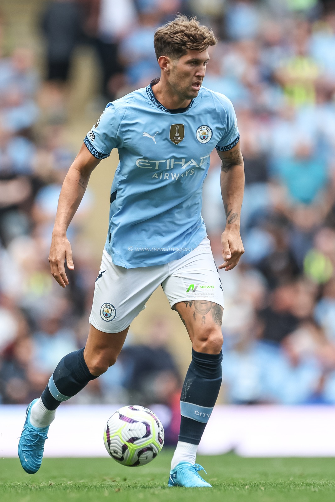 John Stones of Manchester City with the ball during the Premier League match Manchester City vs Ipswich Town at Etihad Stadium, Manchester, United Kingdom, 24th August 2024

(Photo by Mark Cosgrove/News Images)