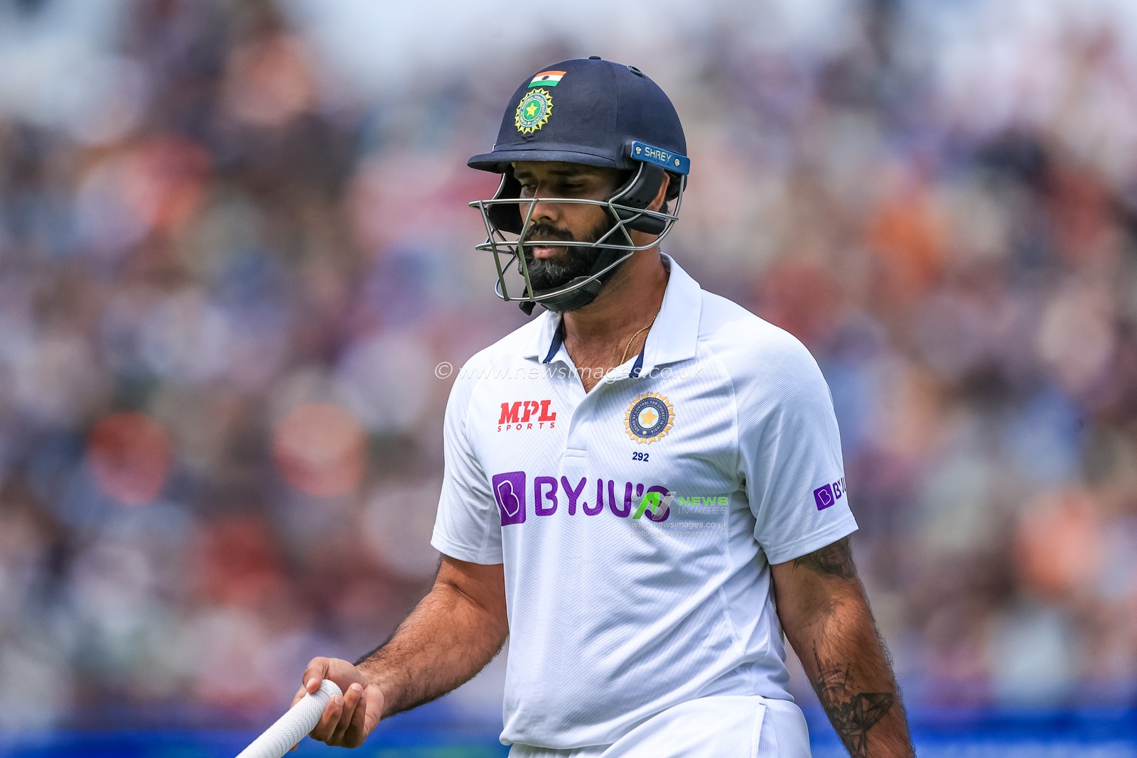 A dejected Hanuma Vihari of India leaves the field after being bowled LBW by Matthew Potts of England