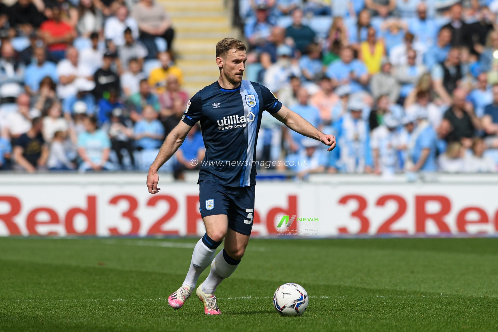 Tom Lees #32 of Huddersfield Town with the ball