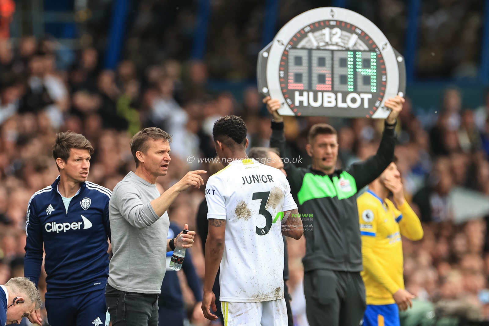 Jesse Marsch manager of Leeds United gives instructions to Junior Firpo #3 of Leeds United during a break in play