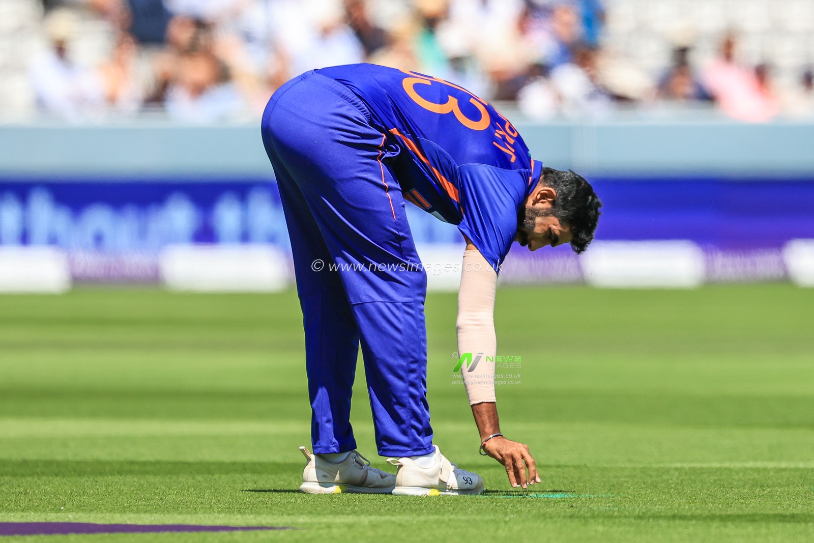 Jasprit Bumrah of India marks his spot for bowling