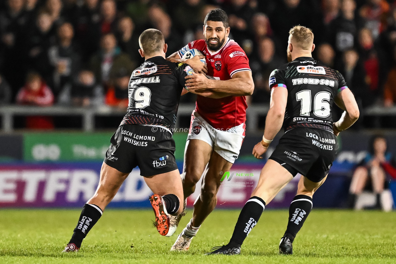 Nene Macdonald of Salford Red Devils its Brad Oâ€™Neill of Wigan Warriors tackled by  during the Betfred Super League Round 5 match Salford Red Devils vs Wigan Warriors at Salford Community Stadium, Eccles, United Kingdom, 14th March 2024

(Photo by Craig Thomas/News Images)