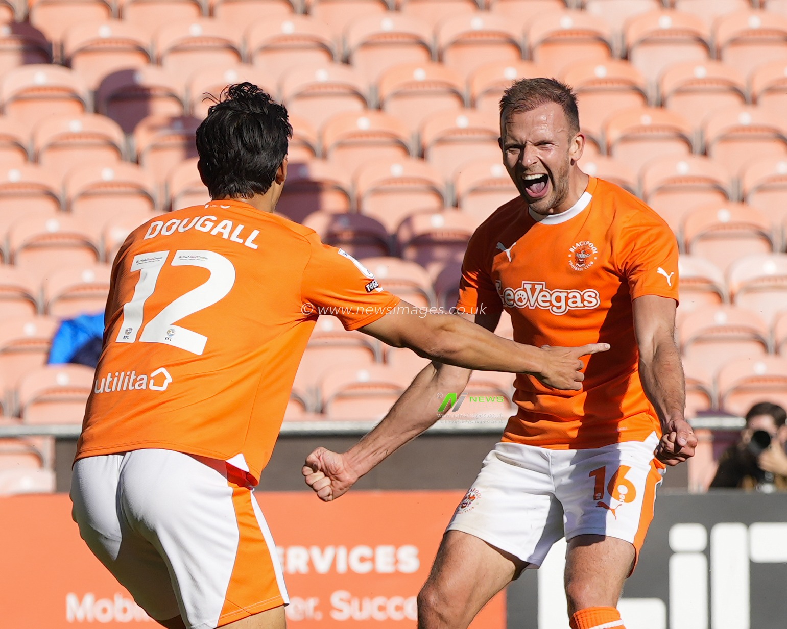 Jordan Rhodes #16 of Blackpool celebrates with goalscorer Kenny Dougall #12 of Blackpool after heâ€™d score3d too make it 2-1 during the Sky Bet League 1 match Blackpool vs Wigan Athletic at Bloomfield Road, Blackpool, United Kingdom, 2nd September 2023

(Photo by Steve Flynn/News Images)