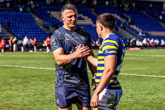 Sam Burgess manager of Warrington shakes hands with Josh Smith of Warrington Wolves as he is named player of the match during the Betfred Super League round 12 match Warrington Wolves vs Bradford Bulls at The Halliwell Jones Stadium, Warrington, United Kingdom on 24 May 2026

(Photo by Alfie Cosgrove/News Images)