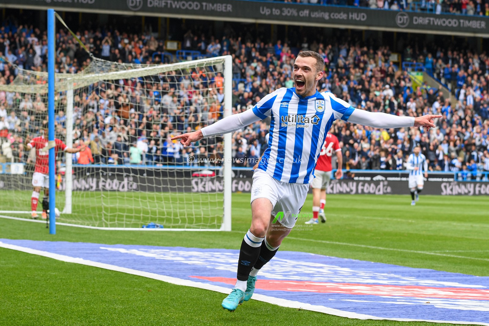 Harry Toffolo #3 of Huddersfield Town celebrates scoring a goal to make it 1-0